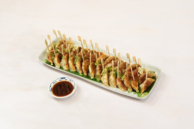 Let us take the hassle out of your canape party by providing you with a delicious  gyoza selection containing 30 pieces of gyoza. Perfect for 10 to 12 people. Comes with Chinese black vinegar, crispy chilli oil dressing and skewers. 30 pieces