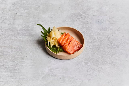 Scottish salmon sashimi served with natural pickled ginger, soy sauce and wasabi. 4 pieces.