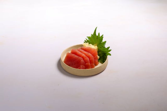 Yellowfin tuna sashimi served with natural pickled ginger, soy sauce and wasabi. 4 pieces.