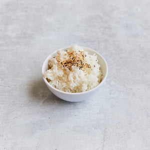 Jasmine rice served with black and white sesame seeds. 1 serving.