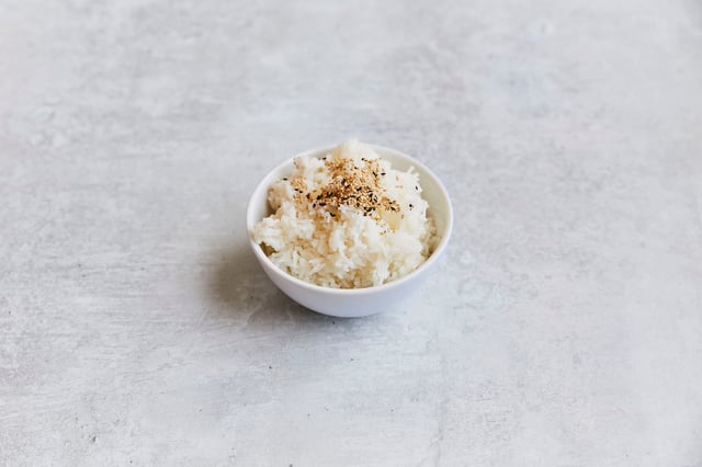 Jasmine rice served with black and white sesame seeds. 1 serving.