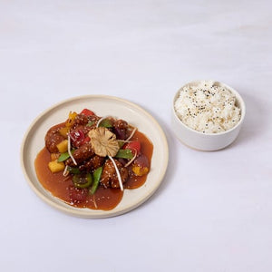 Tender chicken bites, tamarind sweet & sour sauce, pineapple, and peppers. Served with steamed jasmine rice. 